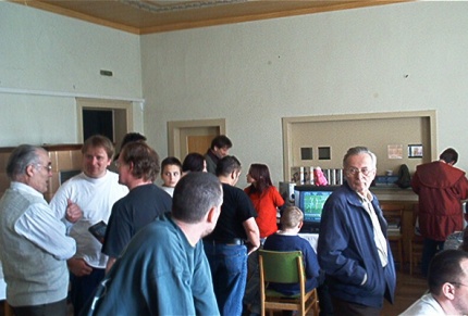 [Photo: The room filling with visitors]