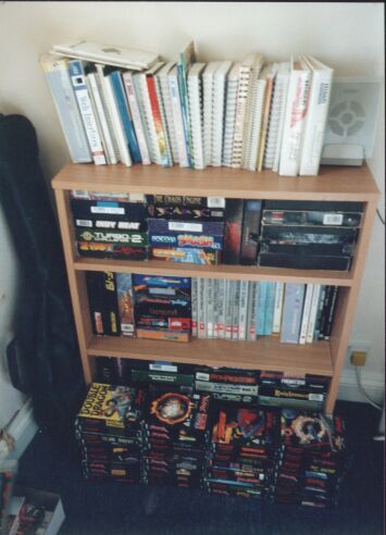 [Photo: Book case next to the Falcon]