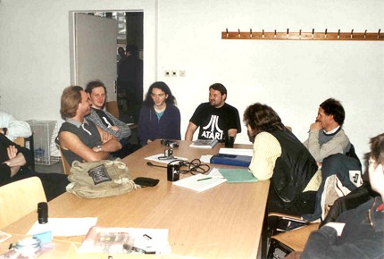 [Photo: Group discussion]