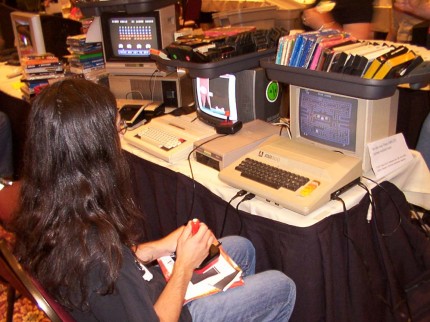 [Photo: Gamer playing Pac-Man on an Atari 800]