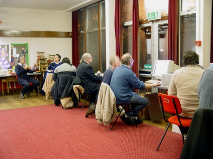 [Photo: Club members all busy]