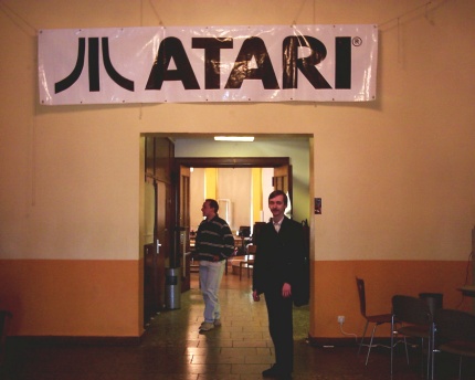 [Photo: Atari banner above doorway]
