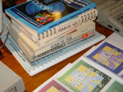 [Photo: Books and Atari scene music CDs]