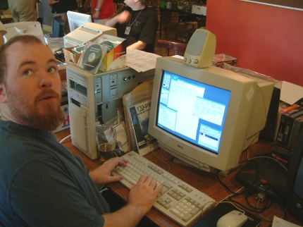 [Photo: Graeme Hinchliffe working on some code]