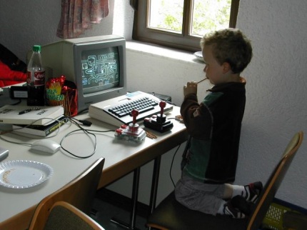 [Photo: Young gamer]
