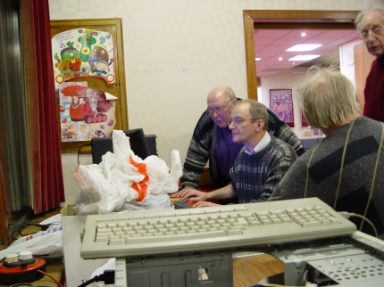 [Photo: Derryck playing with a PC]