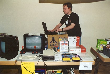 [Photo: Mad Butscher and laptop]