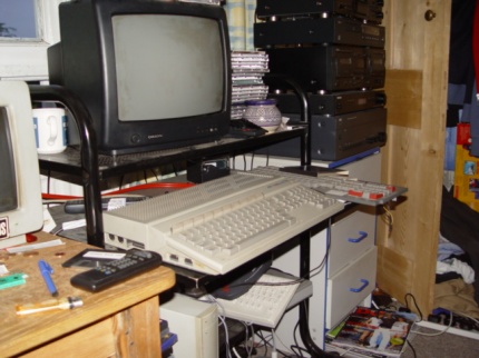 [Photo: Main work area with SC1224 and colour television]