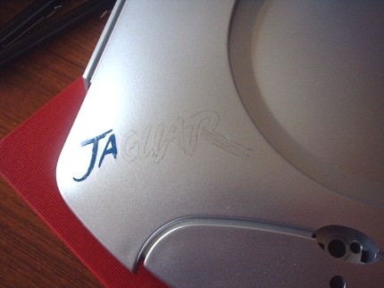 [Photo: Pencil outline of Jaguar logo]