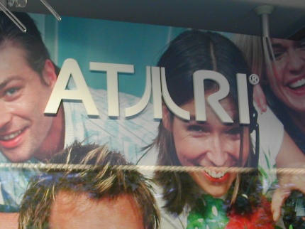 [Photo: Atari logo close-up]