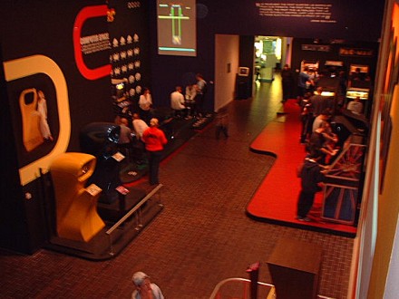 [Photo: Early Arcade Games room]