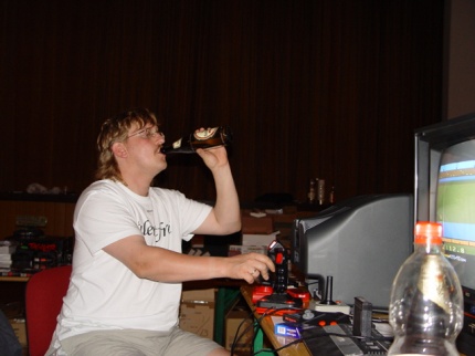 [Photo: R.I.K. drinking while playing]