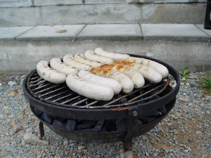 [Photo: Sausages on the barbecue]